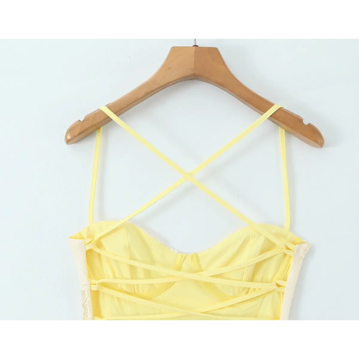 Close-up of the crisscross lace-up closure at the open back.