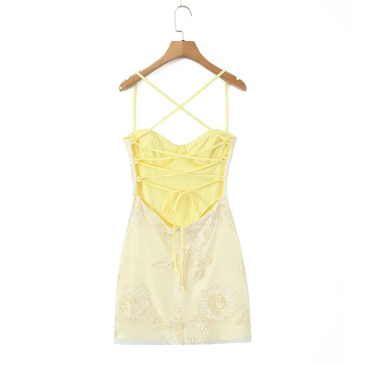 Full back view of the dress, showcasing the open back, crisscross lace-up closure, and tie detail.