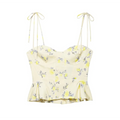 Full front view on white background of yellow floral print tie-strap peplum corset camisole top