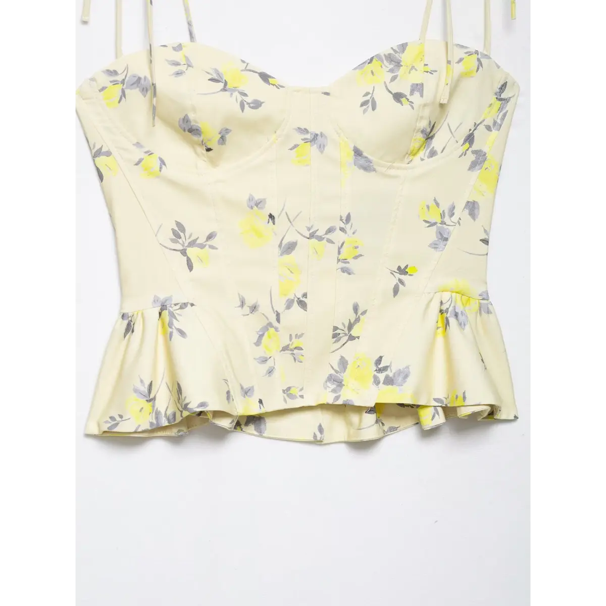 Full front view on white background of yellow floral print tie-strap corset camisole top