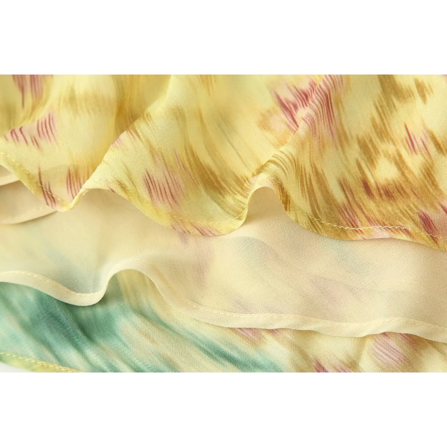 Extreme closeup center back twist knot, multi-layer chiffon folded tie construction, blended pink green floral print drape texture