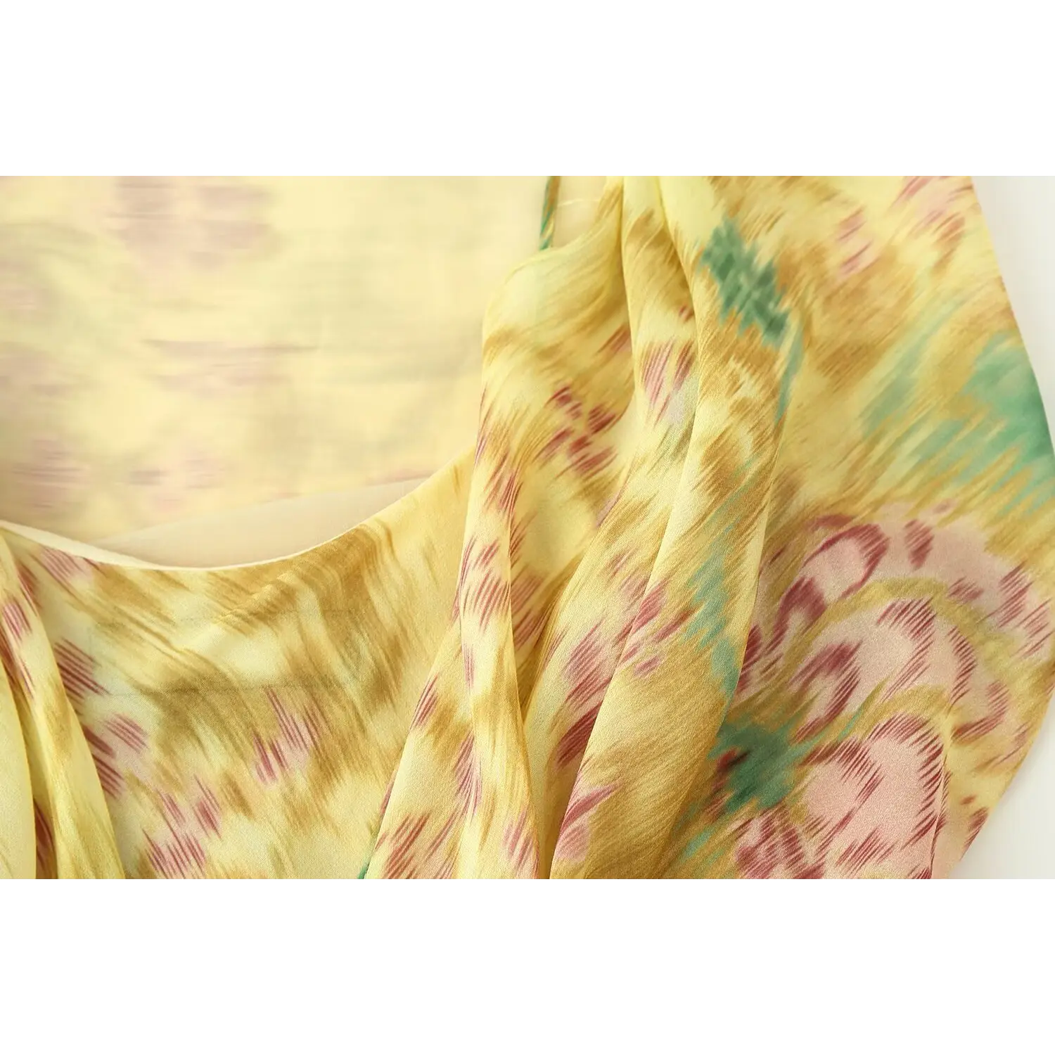 Upper back closeup, center self-fabric twist tied knot, hollow cutout behind bust, double layer chiffon construction, soft watercolor floral weave