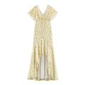 Yellow floral print maxi dress, front full view, deep v neck, flutter short sleeves with white lace trim, front tie detail, irregular ruffle hem