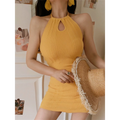 Mustard yellow stretch ribbed halter mini dress half body shot, gathered keyhole bust slim skirt, model holding pearl frayed straw hat soft home styling
