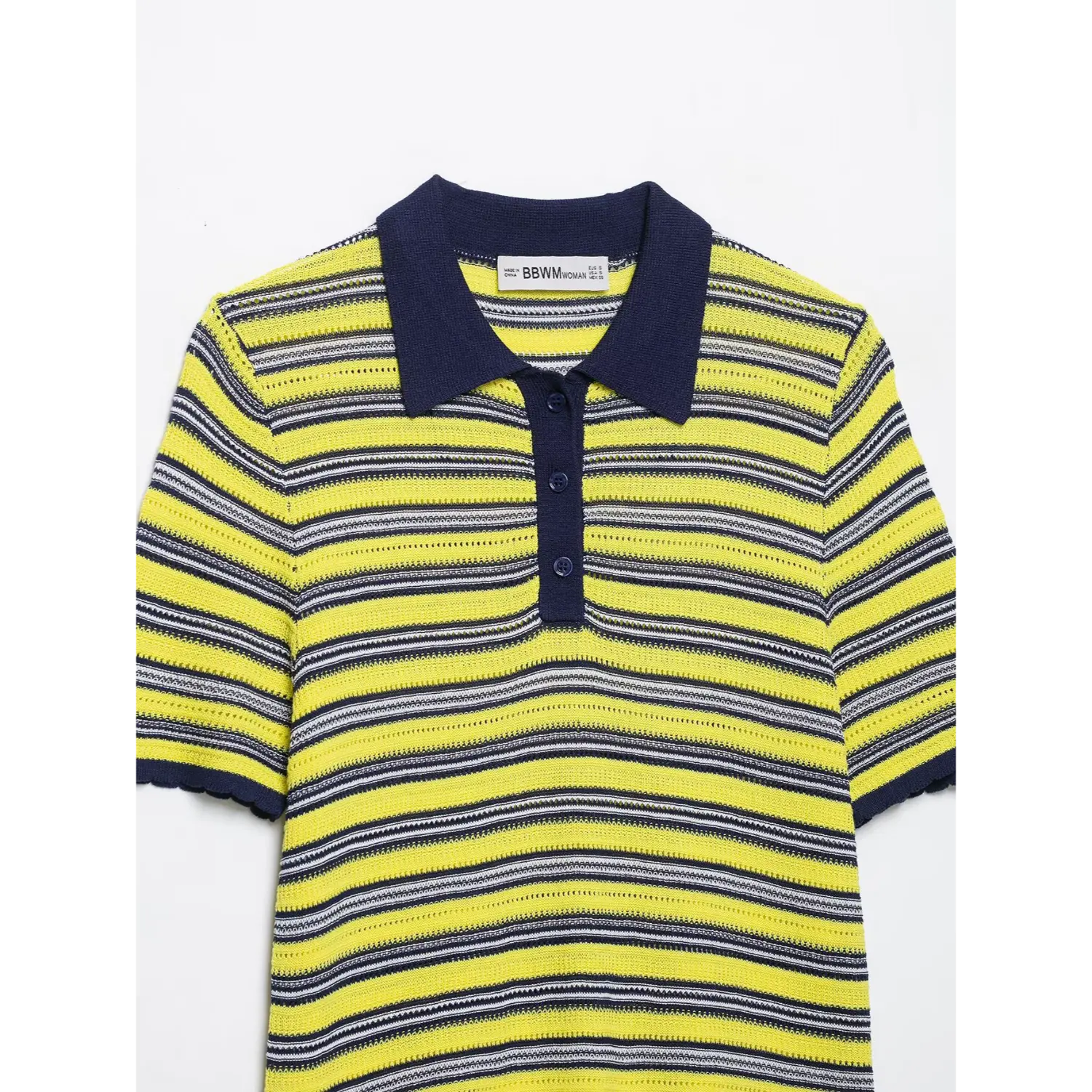 Partial front shot of yellow navy striped knit polo top, contrast navy polo collar, half button placket, openwork mesh knit, scalloped sleeve hem