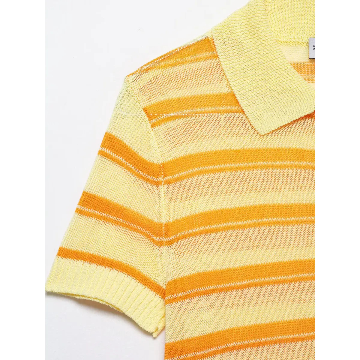 Close-up detail of the ribbed short sleeve cuff and mesh fabric texture on a yellow and orange striped knit polo top.