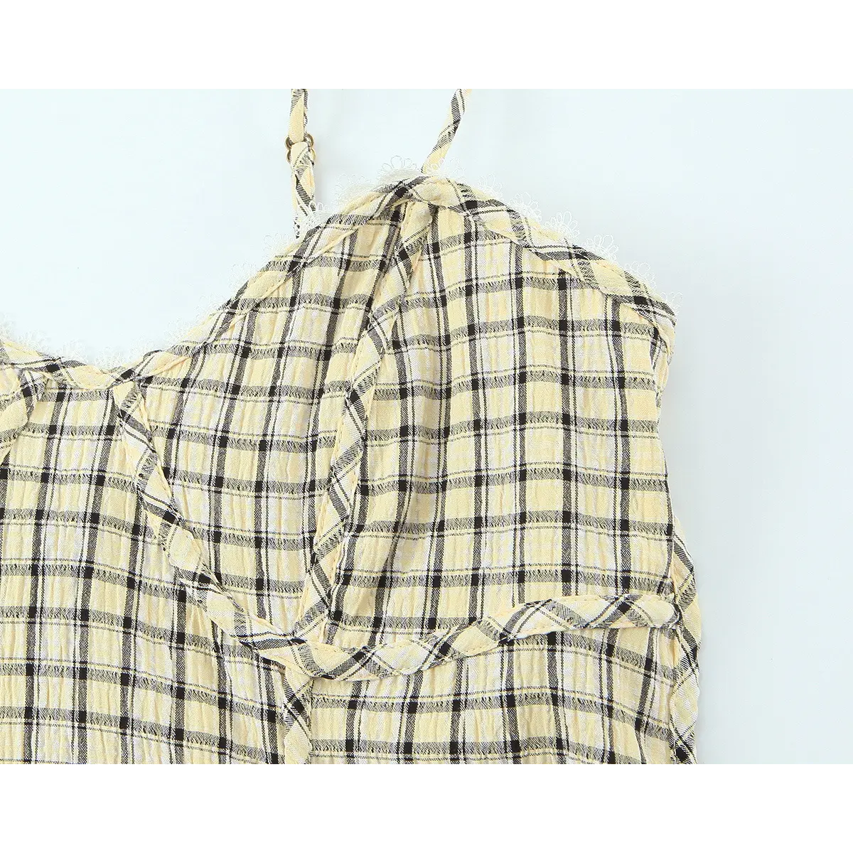 Close-up of the camisole's bust area, showing the sweetheart neckline and lace trim
