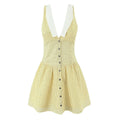 Flat lay sleeveless lace collar yellow dot mini dress