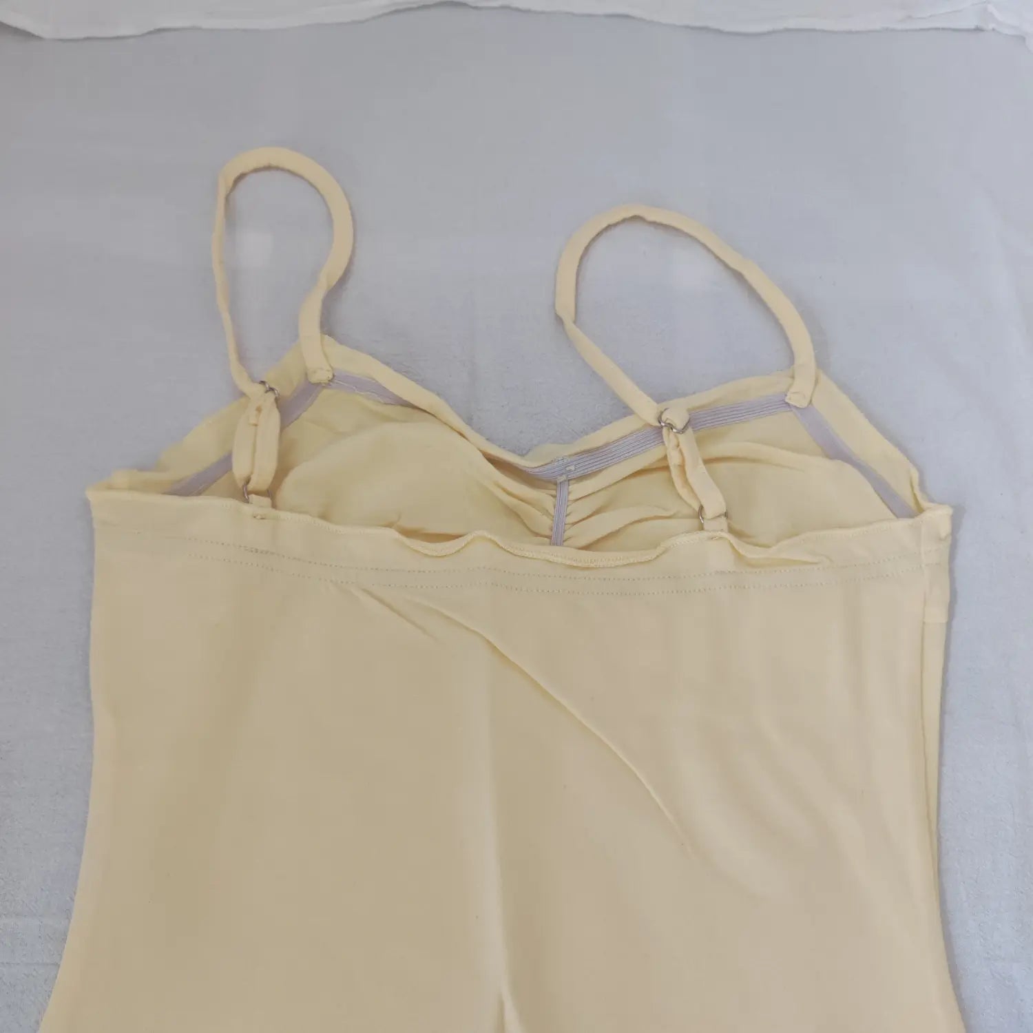 Inside view of dress bust, adjustable shoulder sliders and elastic band detail