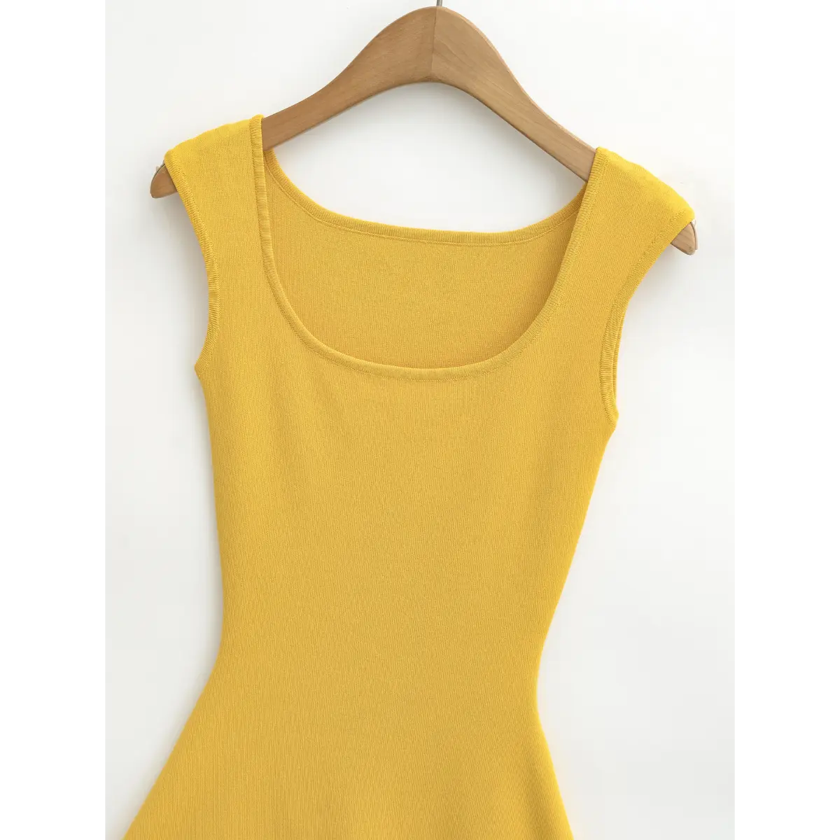 Full back shot of the yellow knit dress, highlighting the square back neckline and fitted bodice.