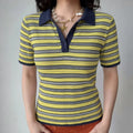 Front lifestyle shot on model, contrast navy polo collar, three-button placket, yellow navy white striped openwork knit short sleeve top, matched with shell starfish necklace and orange bottoms, casual summer outfit