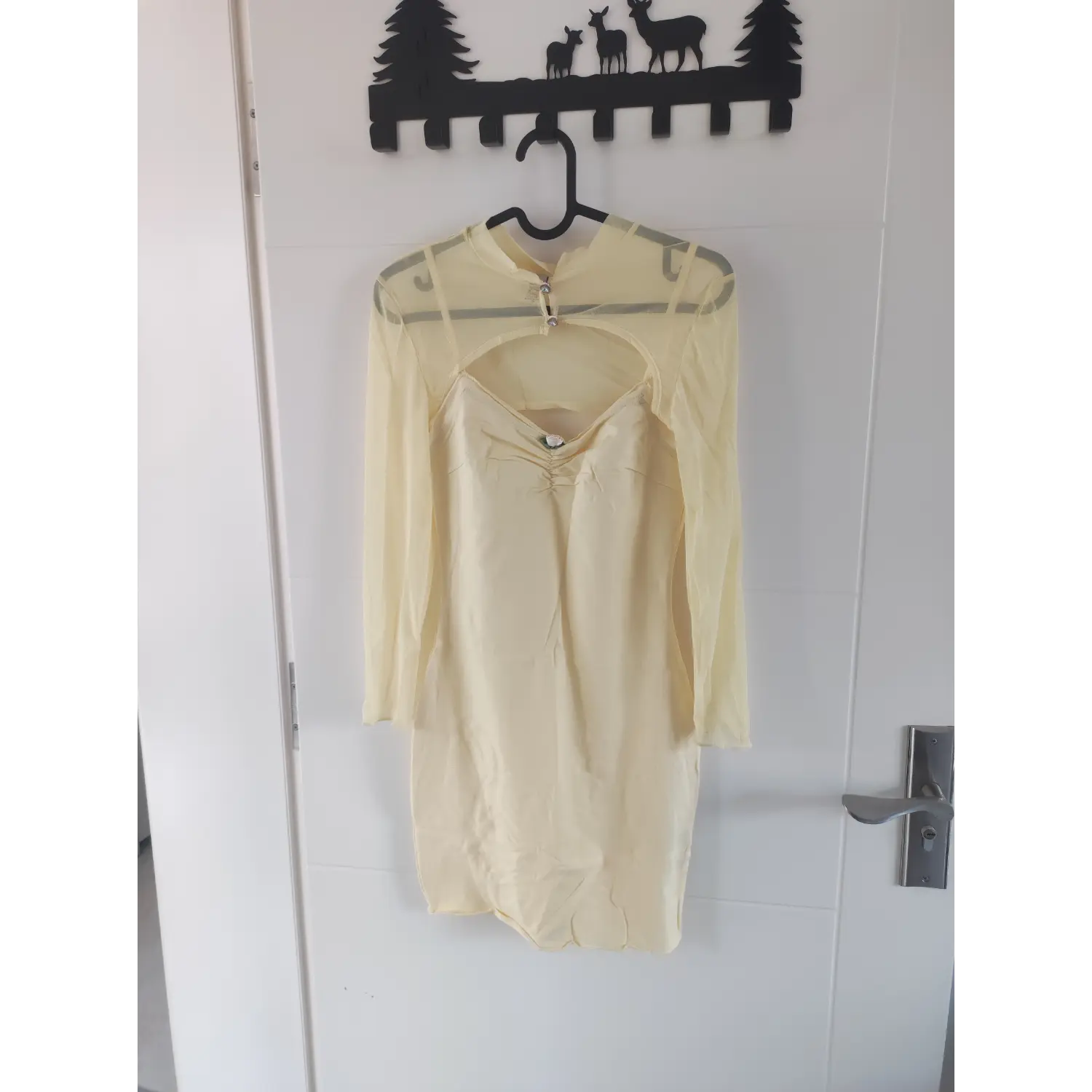 2 piece set pale yellow cami dress + long sleeve mesh cutout shrug front hanging display