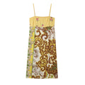 Front flat lay of yellow vintage patchwork floral spaghetti strap midi slip dress on white background