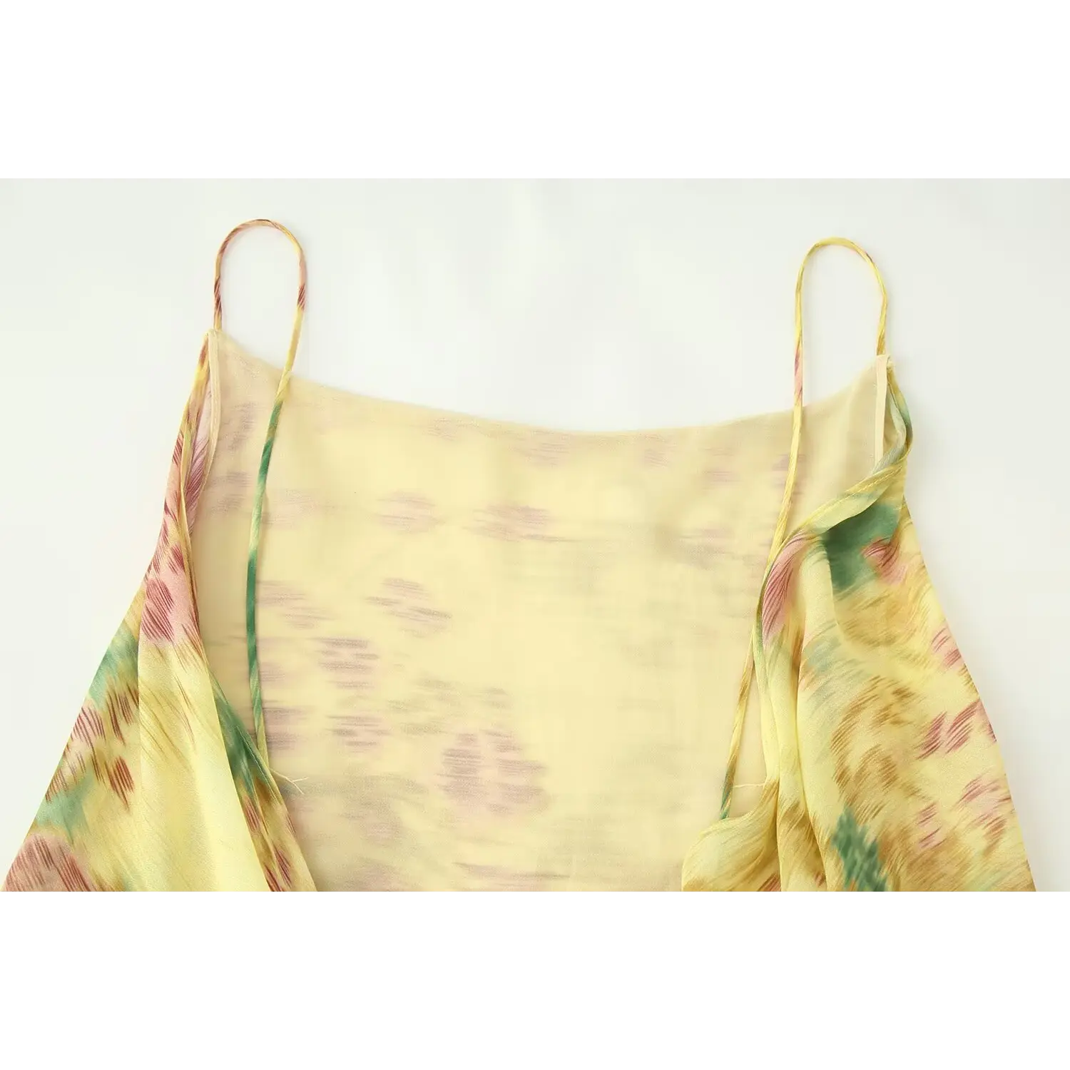 Full front flat view floral chiffon slip dress, straight square front neck, loose unruched front bust, all-over yellow tone abstract flower print, lightweight sheer outer chiffon