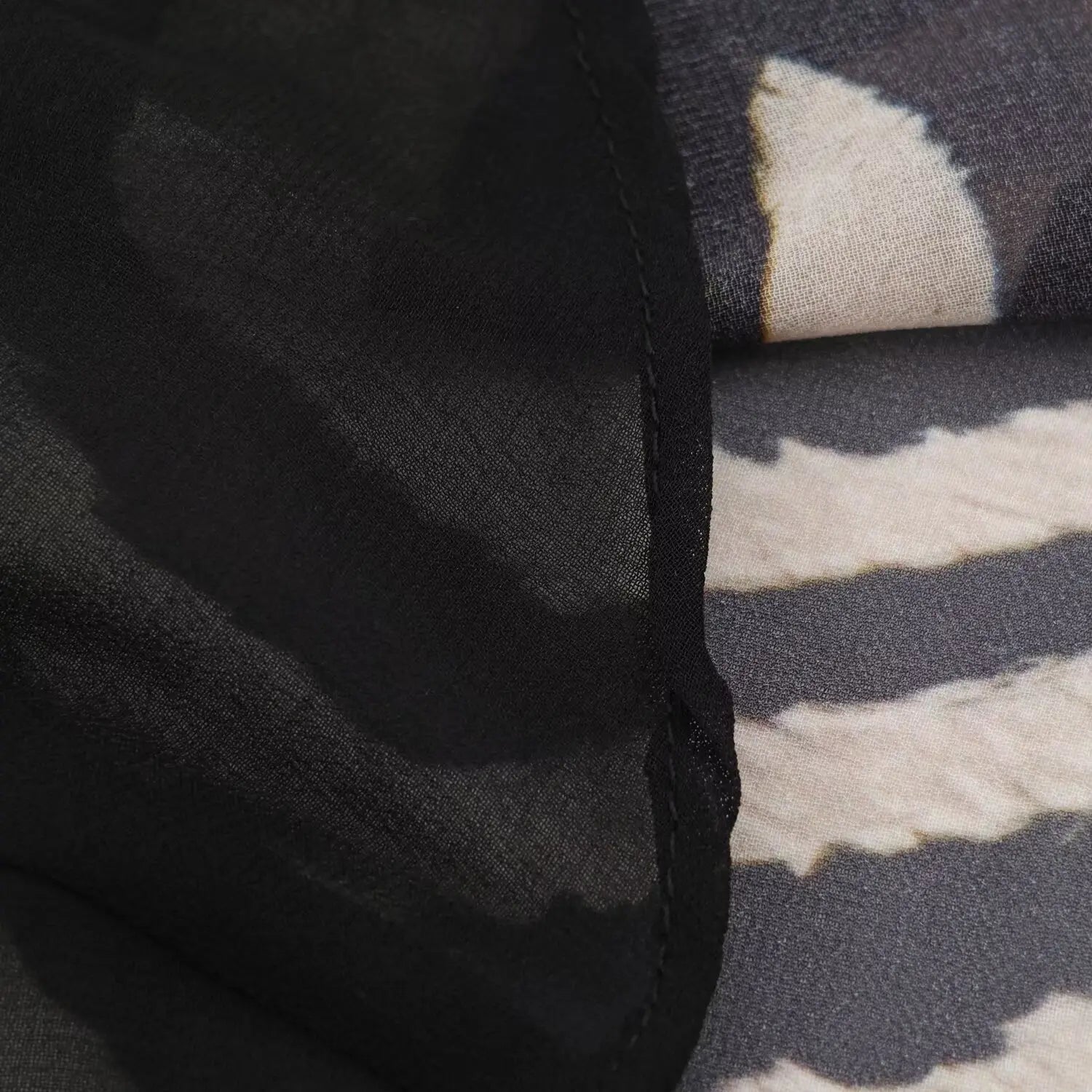 Close‑up texture shot of lightweight chiffon fabric for zebra print halter maxi dress