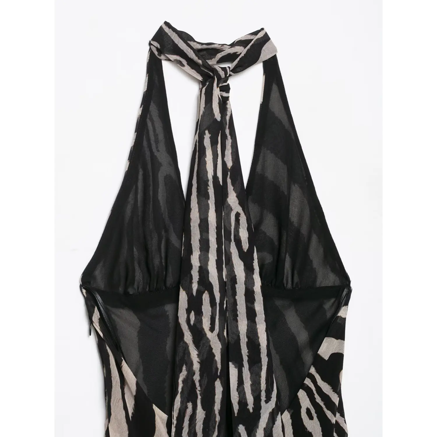 Close‑up back interior view showing halter tie and inner lining of zebra print maxi dress