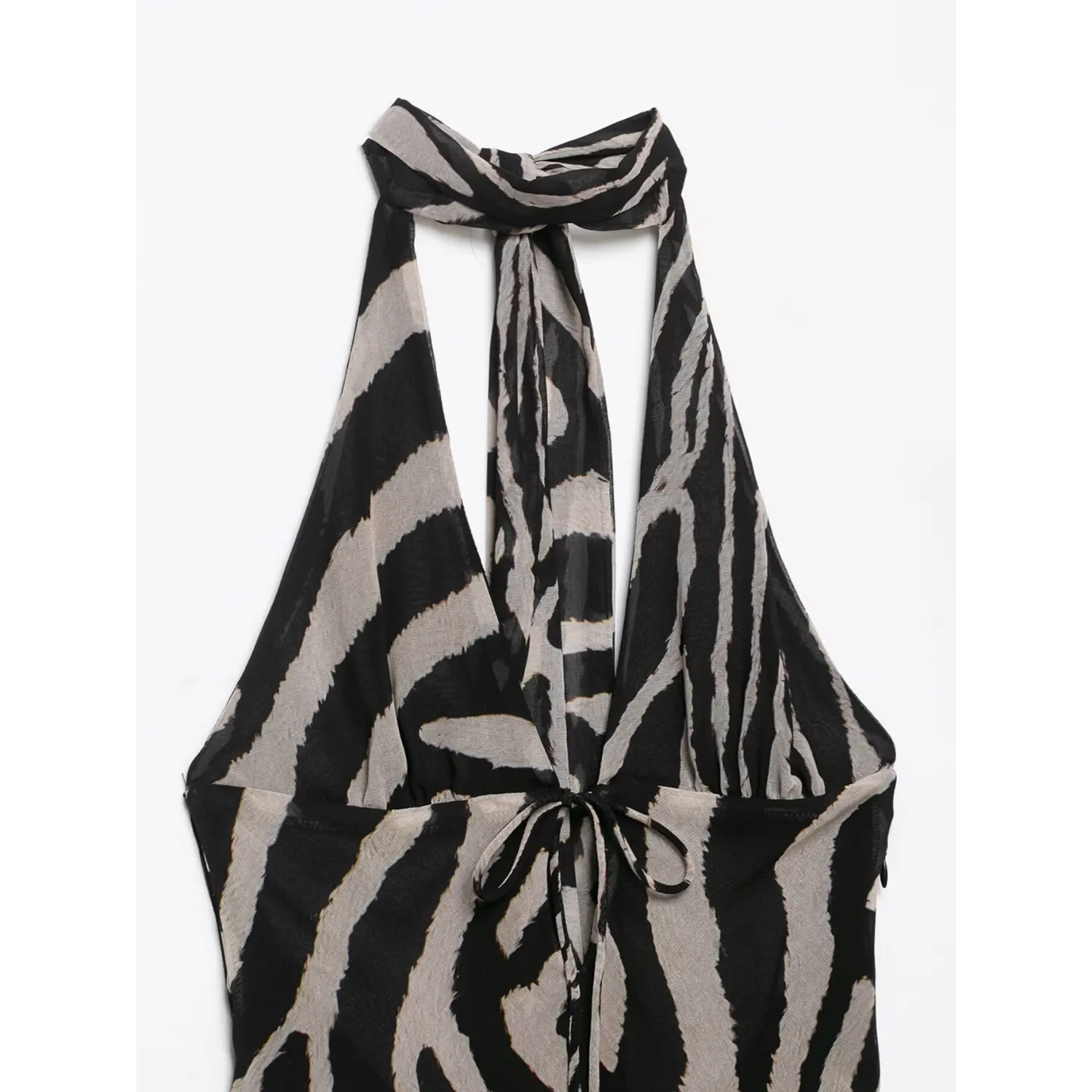 Close‑up front bust drawstring tie detail of zebra print halter neck sheer maxi dress