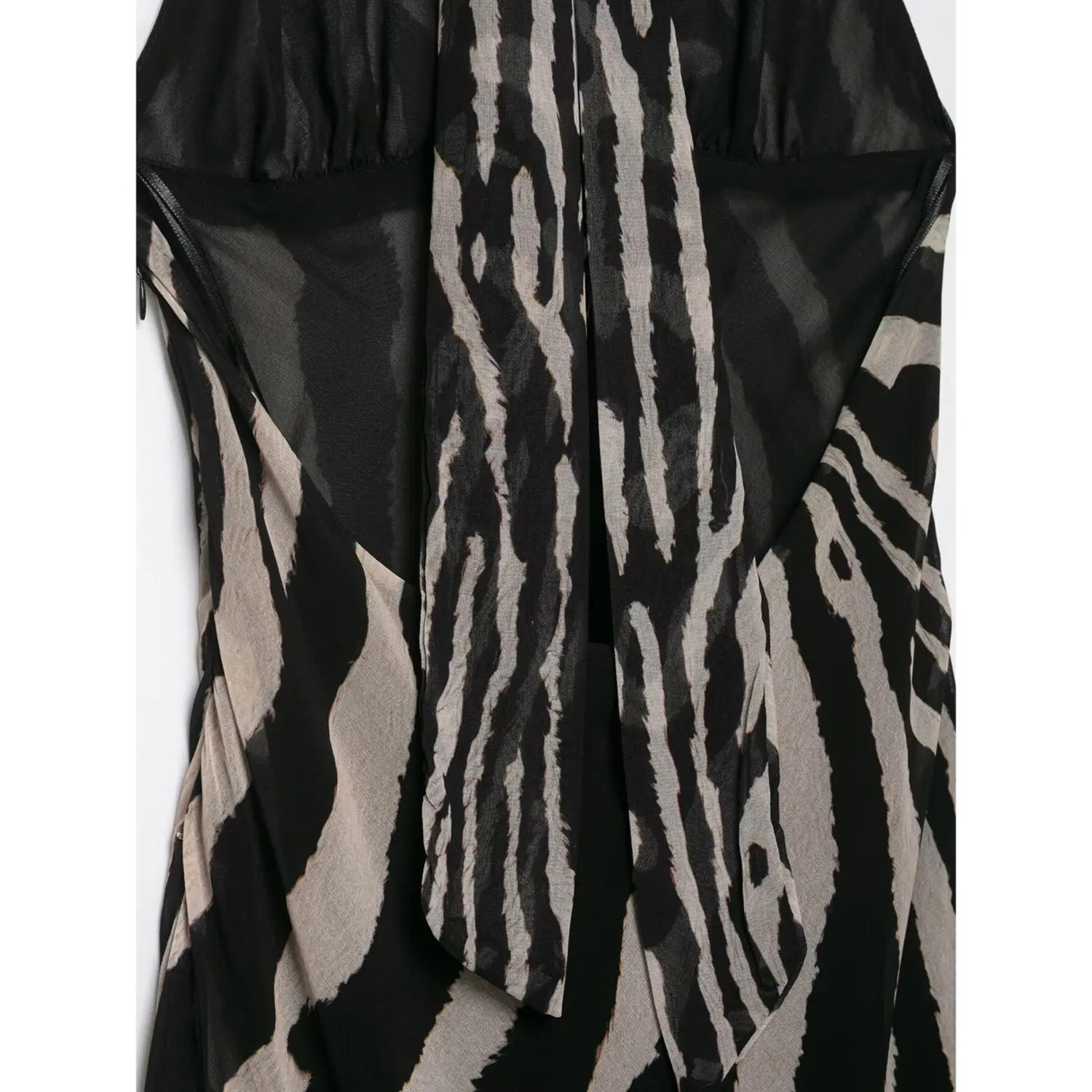 Close‑up back inner lining and halter strap construction detail for zebra print maxi dress