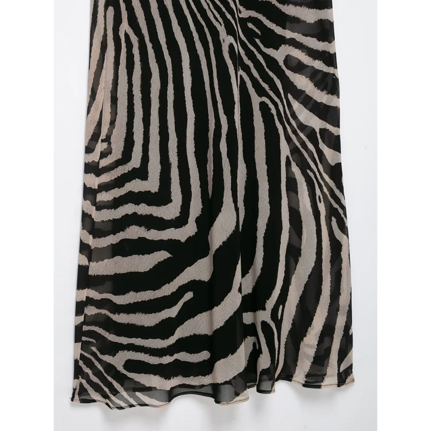 Close‑up flowing skirt fabric texture of zebra print halter neck sheer mesh maxi dress